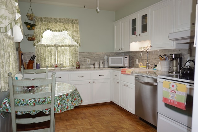 20727 Carlysle St, Dearborn, MI 48124 - kitchen with white appliances, a sink, backsplash, white cabinetry, and glass insert cabinets