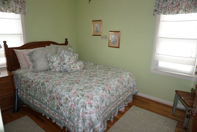 20727 Carlysle St, Dearborn, MI 48124 - bedroom featuring multiple windows, wood finished floors, and baseboards