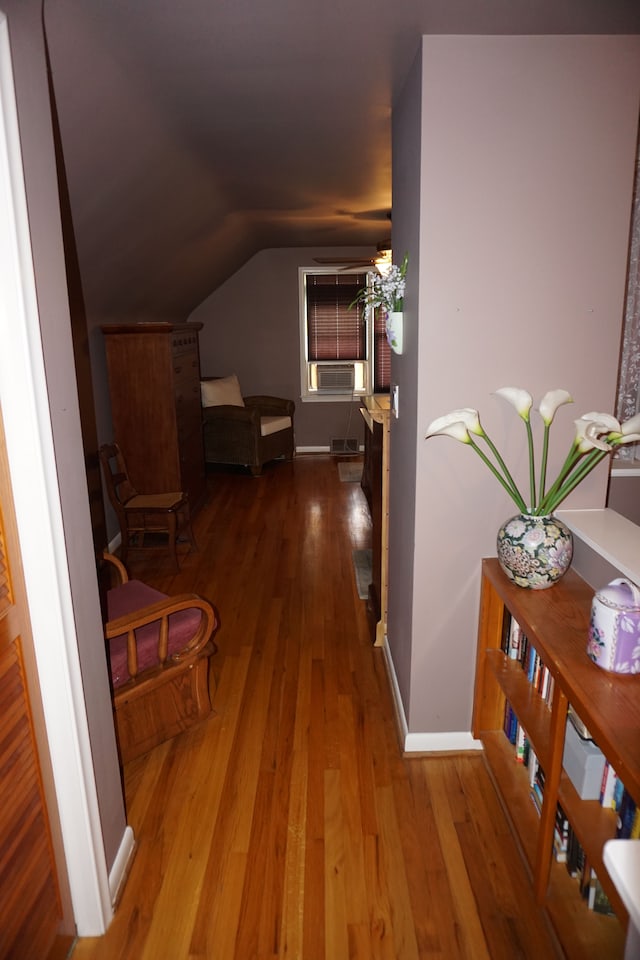 20727 Carlysle St, Dearborn, MI 48124 - corridor featuring wood finished floors, vaulted ceiling, and baseboards