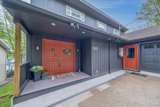 11290 Alpine Rd, Canadian Lakes, MI 49346 - doorway to property featuring board and batten siding and a porch