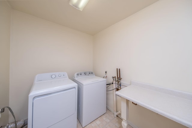 11290 Alpine Rd, Canadian Lakes, MI 49346 - laundry room with washing machine and clothes dryer and baseboards