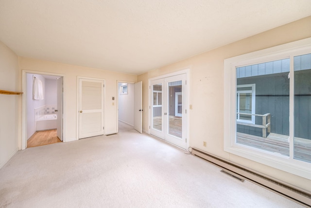 11290 Alpine Rd, Canadian Lakes, MI 49346 - unfurnished room with carpet floors, a baseboard heating unit, and baseboards