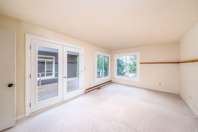 11290 Alpine Rd, Canadian Lakes, MI 49346 - carpeted empty room with a baseboard heating unit, french doors, and baseboards