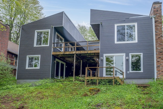 11290 Alpine Rd, Canadian Lakes, MI 49346 - back of property with a wooden deck