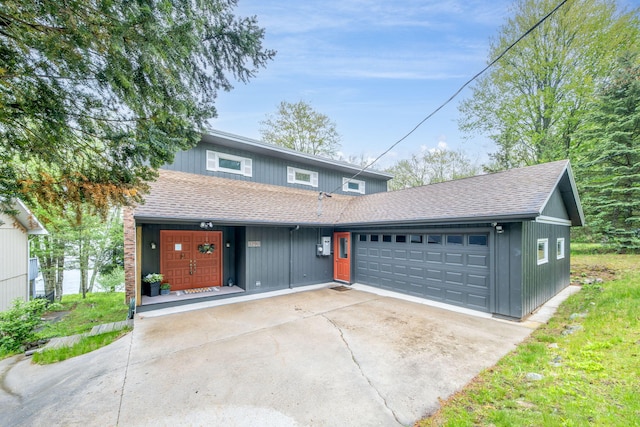 11290 Alpine Rd, Canadian Lakes, MI 49346 - view of front of house featuring roof with shingles and a garage