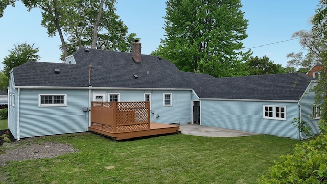 6 Congress Ct Unit D, Saginaw, MI 48602 - back of property featuring a chimney, a wooden deck, a shingled roof, and a lawn