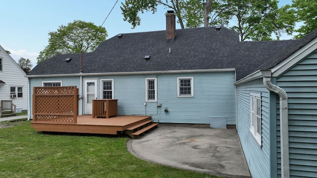 6 Congress Ct Unit D, Saginaw, MI 48602 - rear view of property featuring a chimney, a patio area, a yard, a deck, and roof with shingles