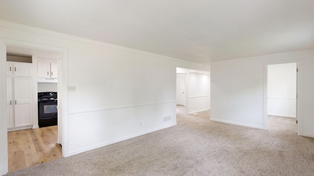 6 Congress Ct Unit D, Saginaw, MI 48602 - empty room with light colored carpet and baseboards
