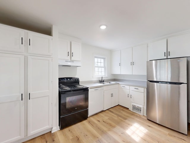 6 Congress Ct Unit D, Saginaw, MI 48602 - kitchen with freestanding refrigerator, white dishwasher, electric range, a sink, and under cabinet range hood