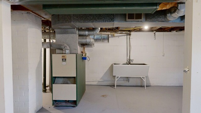 6 Congress Ct Unit D, Saginaw, MI 48602 - unfinished basement featuring a sink and concrete block wall