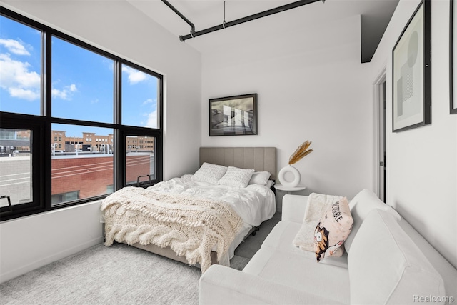 100 N Center St Unit 404, Royal Oak, MI 48067 - carpeted bedroom featuring multiple windows