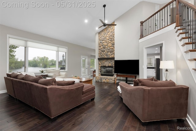 4470 Coastal Pkwy, White Lake, MI 48386 - living room featuring high vaulted ceiling, a fireplace, a ceiling fan, dark wood-style floors, and healthy amount of natural light