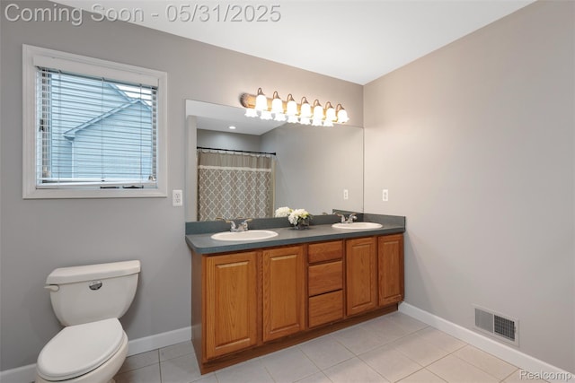 4470 Coastal Pkwy, White Lake, MI 48386 - bathroom featuring baseboards, double vanity, tile patterned floors, and toilet