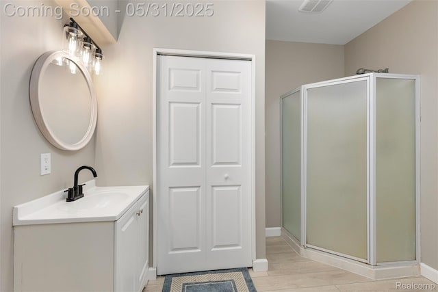 4470 Coastal Pkwy, White Lake, MI 48386 - bathroom with vanity, a stall shower, and baseboards