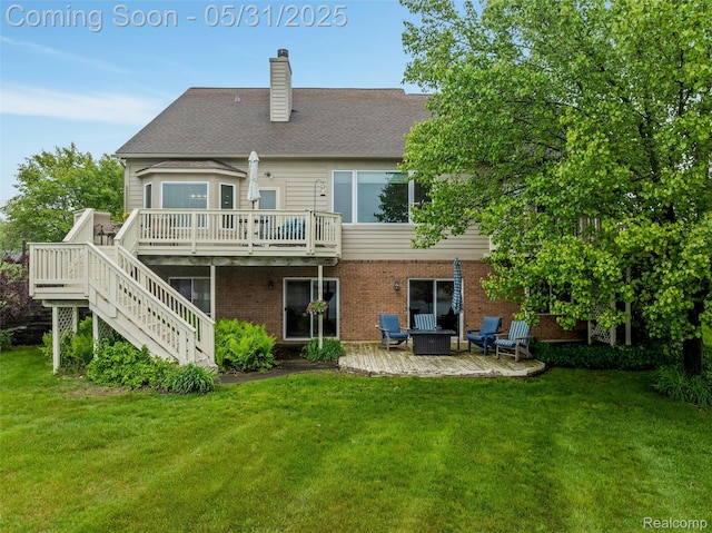 4470 Coastal Pkwy, White Lake, MI 48386 - back of property with a deck, a chimney, stairs, a patio area, and a lawn