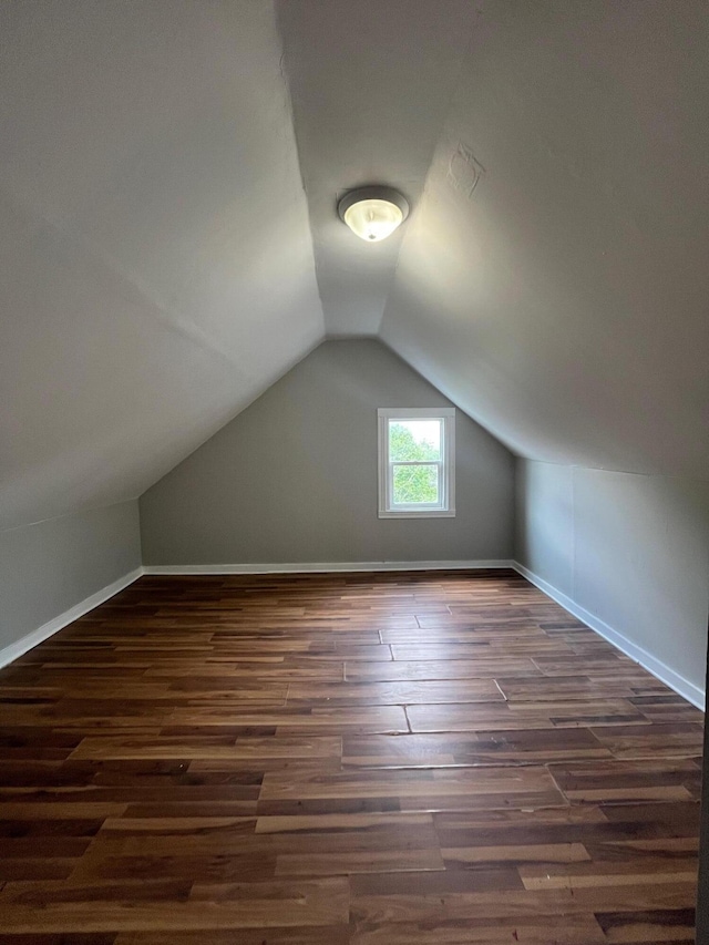 611 New Ave SW, Grand Rapids, MI 49503 - bonus room with wood finished floors, vaulted ceiling, and baseboards