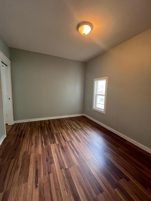 611 New Ave SW, Grand Rapids, MI 49503 - unfurnished room with dark wood-style floors and baseboards