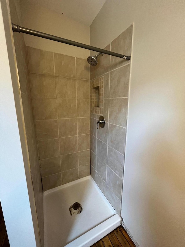 611 New Ave SW, Grand Rapids, MI 49503 - bathroom featuring a shower stall and wood finished floors