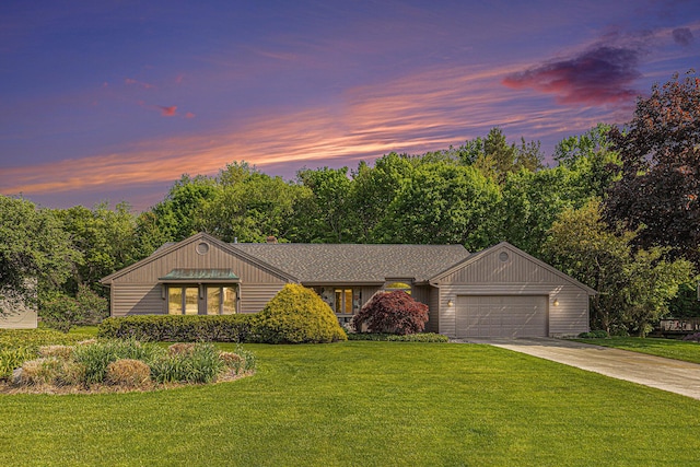 7664 Kenrob Dr SE, Grand Rapids, MI 49546 - ranch-style home featuring an attached garage, concrete driveway, and a front yard