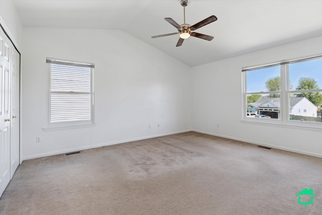 7458 Knollwood Dr, Ypsilanti, MI 48197 - spare room with vaulted ceiling, a ceiling fan, carpet, and baseboards