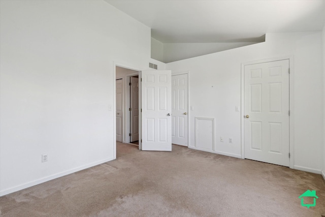 7458 Knollwood Dr, Ypsilanti, MI 48197 - unfurnished bedroom featuring carpet floors, lofted ceiling, and baseboards