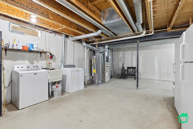 7458 Knollwood Dr, Ypsilanti, MI 48197 - unfinished basement with washer and dryer, gas water heater, and freestanding refrigerator