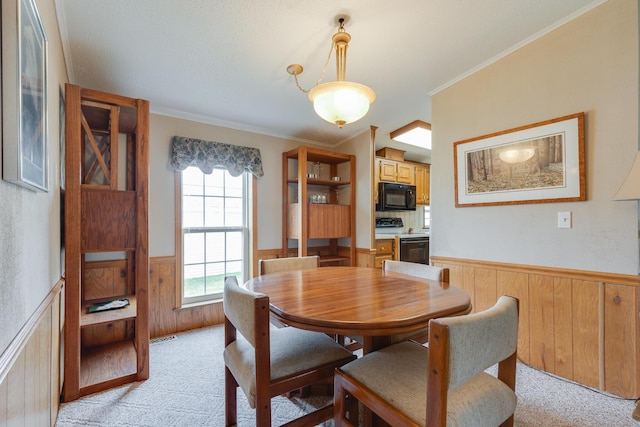 305 Oak Ridge St, Mason, MI 48854 - dining room featuring a wainscoted wall, light colored carpet, and crown molding