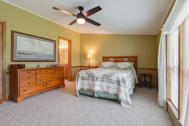305 Oak Ridge St, Mason, MI 48854 - carpeted bedroom featuring crown molding, a ceiling fan, and ensuite bathroom