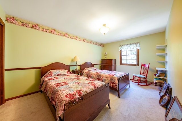 bedroom featuring light colored carpet