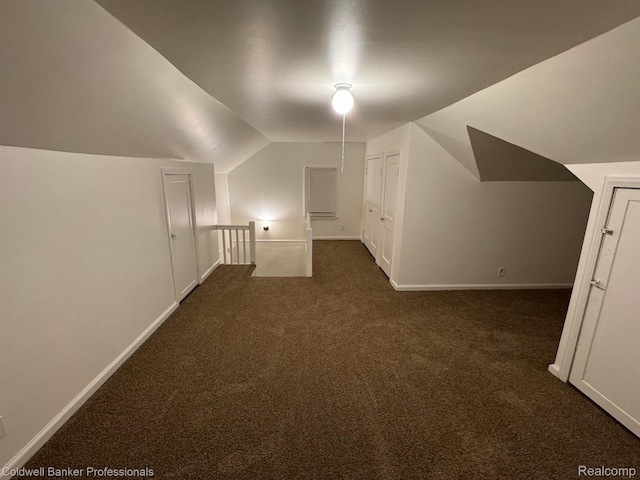 2474 Atkinson St, Detroit, MI 48206 - bonus room featuring dark colored carpet, lofted ceiling, and baseboards
