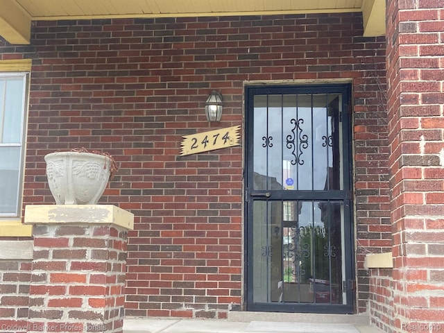 2474 Atkinson St, Detroit, MI 48206 - doorway to property featuring brick siding