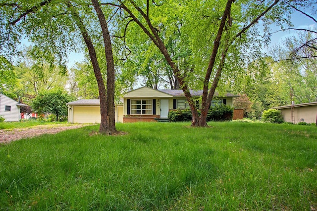 1469 Westwood Dr, Flint, MI 48532 - ranch-style house featuring driveway and a garage
