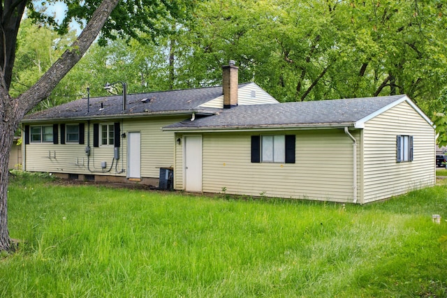 1469 Westwood Dr, Flint, MI 48532 - rear view of property featuring a chimney