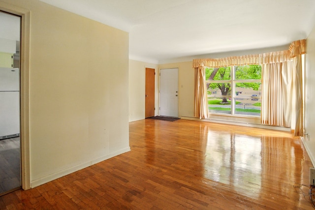 1469 Westwood Dr, Flint, MI 48532 - empty room with wood finished floors and baseboards