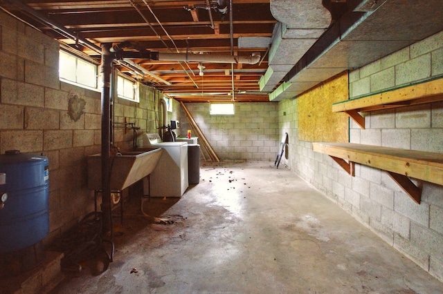 1469 Westwood Dr, Flint, MI 48532 - below grade area with washer / dryer, a water pressure tank, and a sink