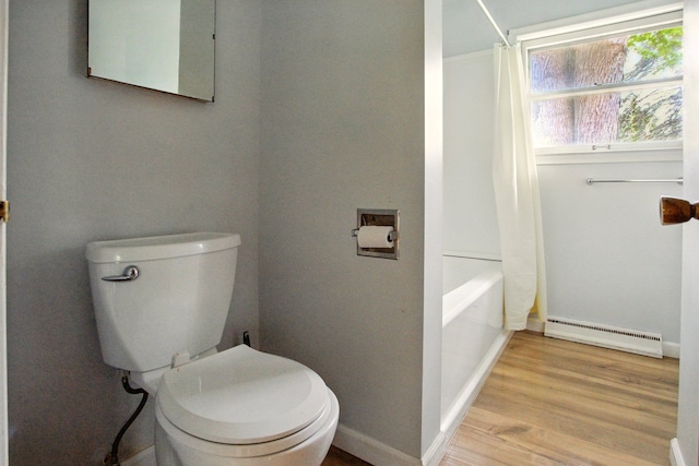 1469 Westwood Dr, Flint, MI 48532 - full bath featuring a baseboard radiator, toilet, wood finished floors, and baseboards
