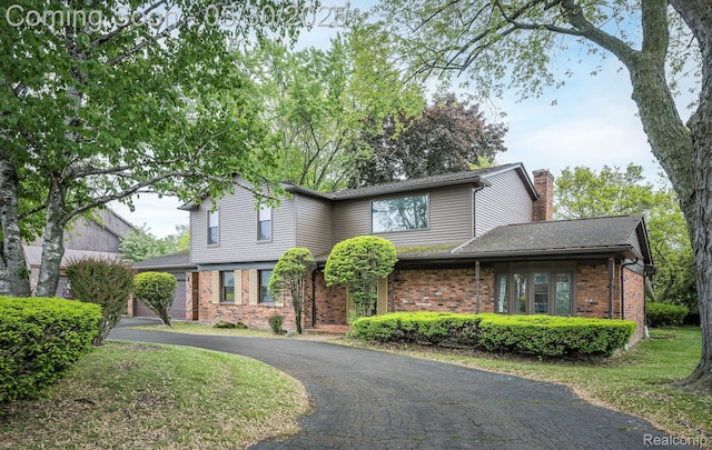 18851 Capitol Dr, Southfield, MI 48075 - traditional-style house with brick siding and a chimney