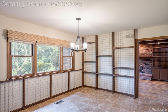 18851 Capitol Dr, Southfield, MI 48075 - unfurnished sunroom with a chandelier