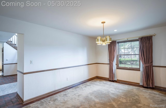 18851 Capitol Dr, Southfield, MI 48075 - empty room featuring a chandelier, baseboards, and wainscoting