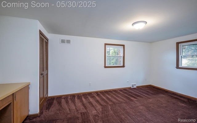 18851 Capitol Dr, Southfield, MI 48075 - unfurnished room featuring dark carpet and baseboards