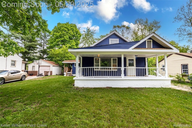 72 N Astor St, Pontiac, MI 48342 - view of front facade featuring a porch, a front lawn, an outbuilding, and a detached garage