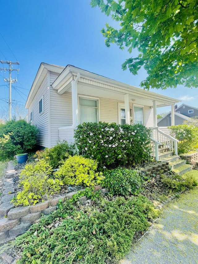 404 W Court St, Ludington, MI 49431 - view of property exterior featuring covered porch