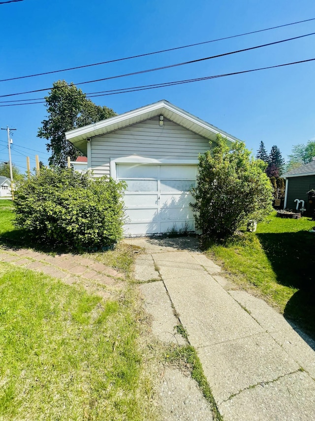 404 W Court St, Ludington, MI 49431 - garage featuring driveway
