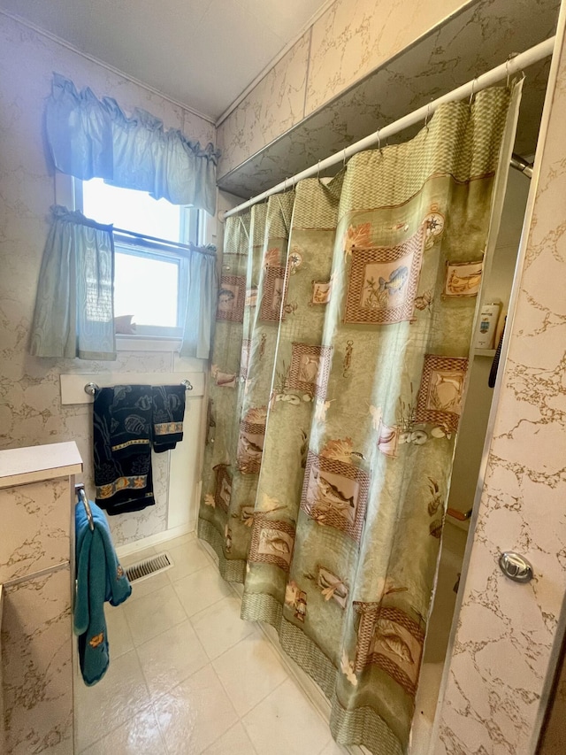 404 W Court St, Ludington, MI 49431 - bathroom featuring a stall shower and wallpapered walls
