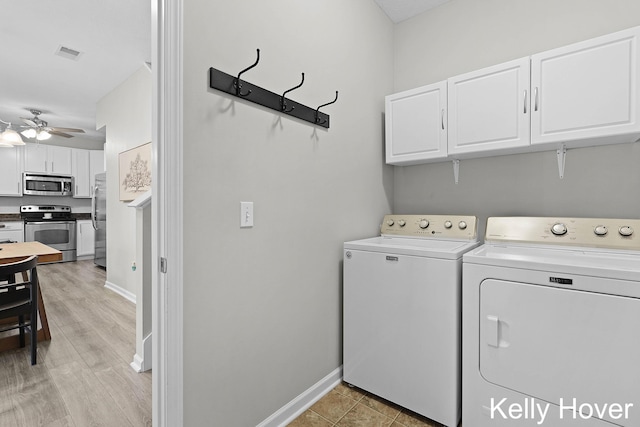 3514 River Run St, Wyoming, MI 49418 - laundry room with cabinet space, independent washer and dryer, a ceiling fan, baseboards, and light wood-type flooring