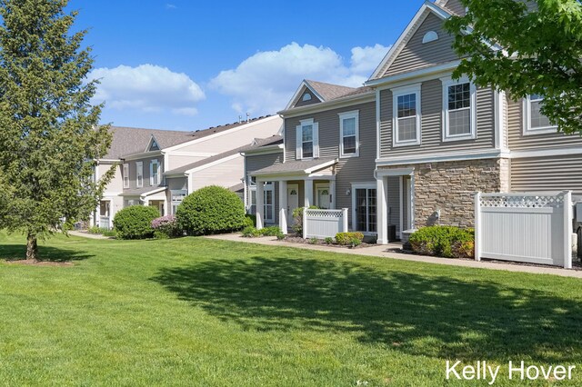 3514 River Run St, Wyoming, MI 49418 - townhome / multi-family property featuring a front yard and stone siding