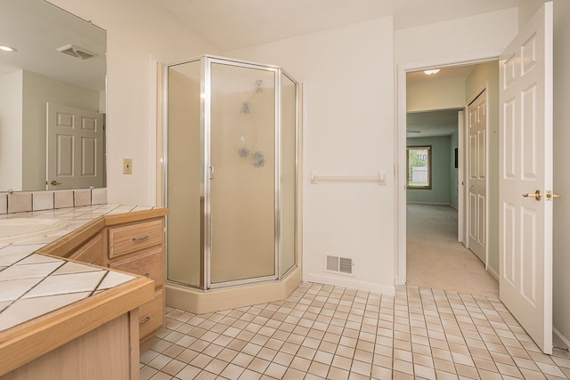 8187 Sawgrass Trl, Grand Blanc, MI 48439 - bathroom featuring a stall shower, vanity, and tile patterned flooring