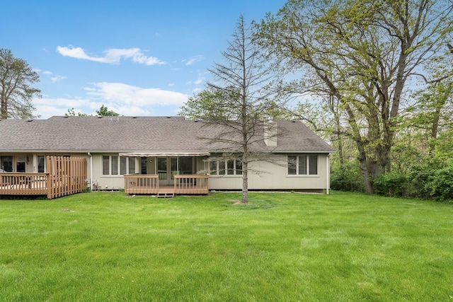 8187 Sawgrass Trl, Grand Blanc, MI 48439 - rear view of property featuring a wooden deck, a lawn, and roof with shingles