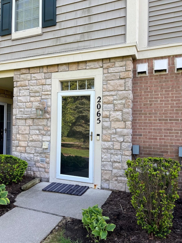 2065 Pinecroft Dr Unit 201, Canton, MI 48188 - entrance to property featuring stone siding