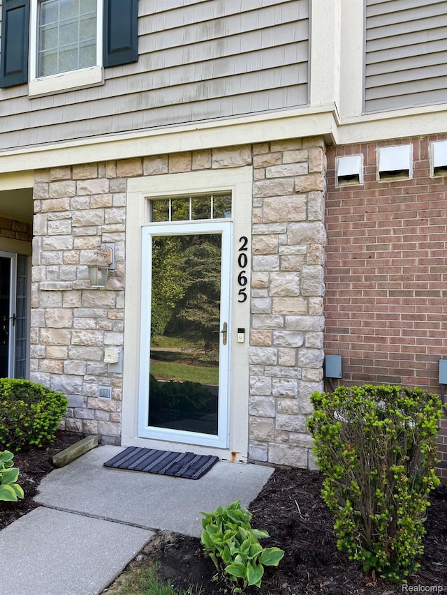 2065 Pinecroft Dr Unit 201, Canton, MI 48188 - property entrance with stone siding